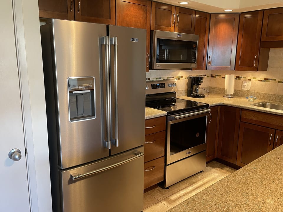 Fridge with ice maker and water dispenser.
