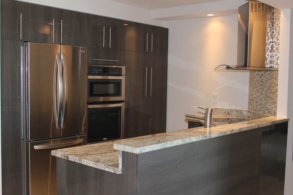 Contemporary kitchen, granite countertop, stainless steel appliances