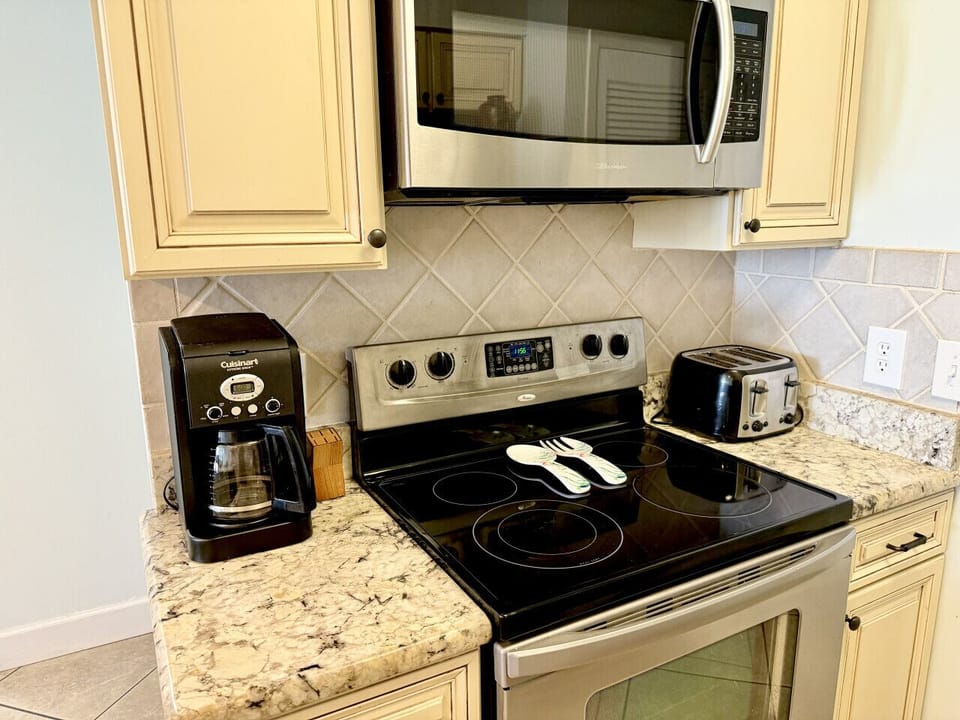 Standard drip coffee machine. Over the range microwave and toaster.