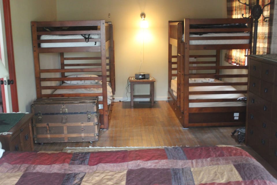 Bedroom with King bed and 2 twin Bunks.
