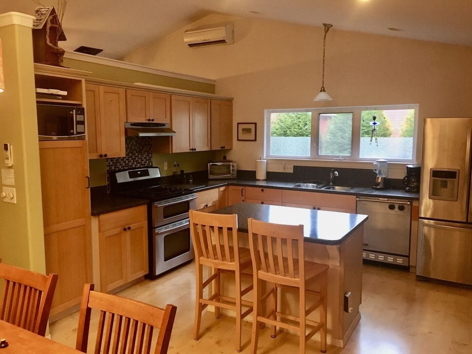 Enjoy the open kitchen with high quality appliances, multi-use island & extras.