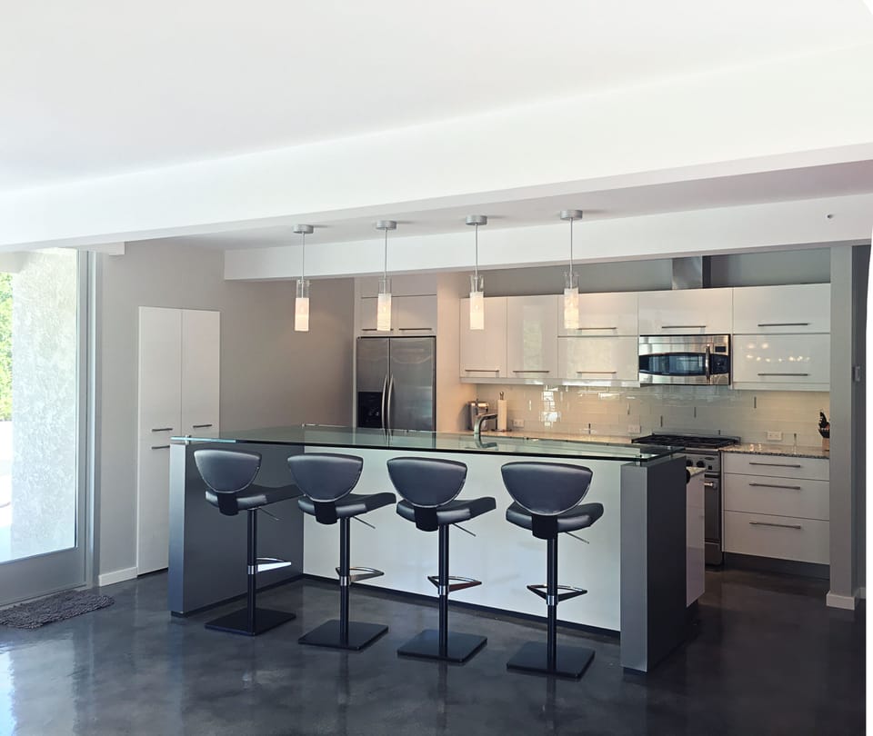 Light dances off sleek surfaces, has commanding views of indoor/outdoor spaces 