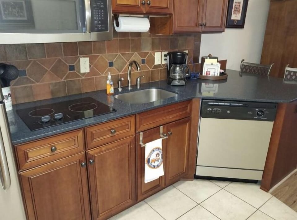 galley kitchen with all cooking essentials.