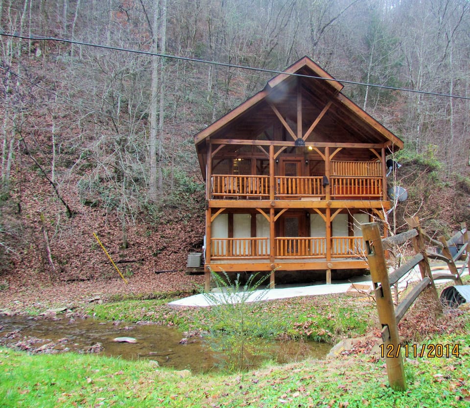 nestled up against a mountain right on a year round creek 
