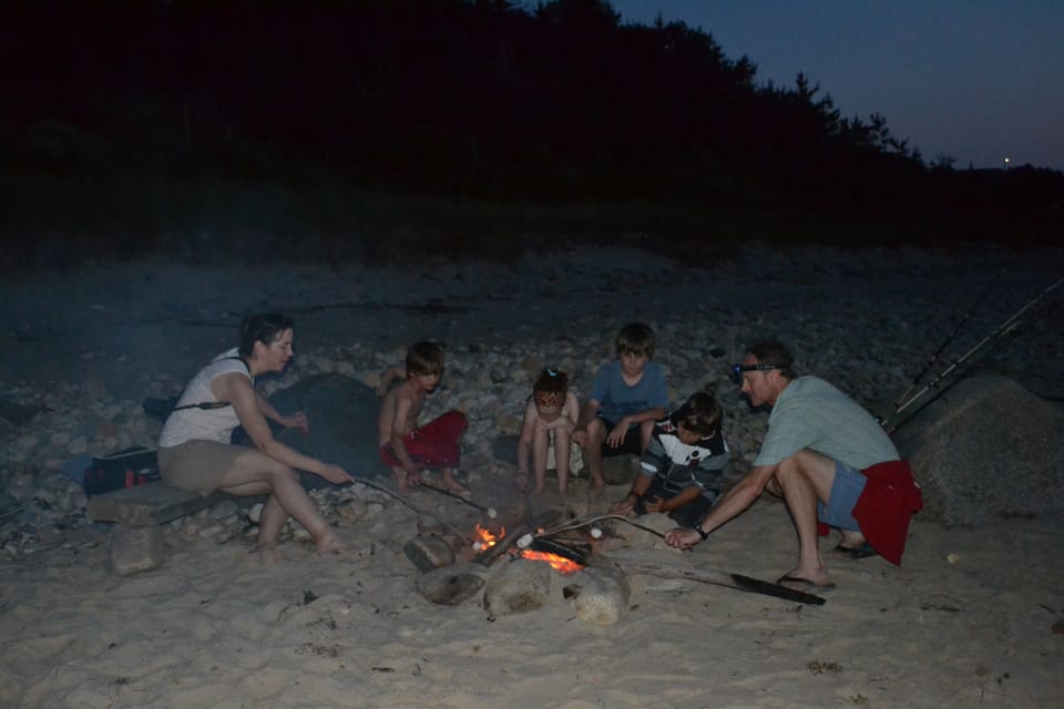 Hot dogs and s'mores on our beach while others fish from shore
