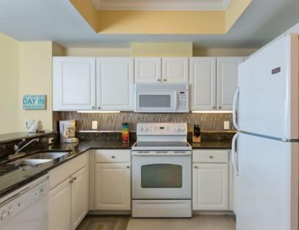 The kitchen boasts granite countertops and all the conveniences of home