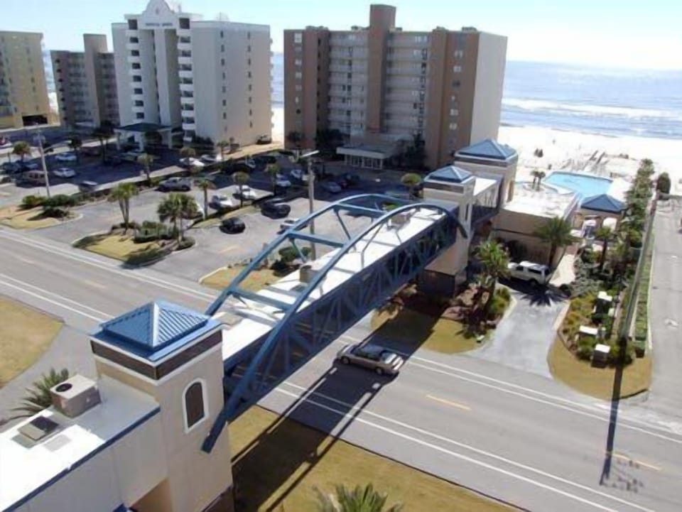 Private, climate controlled walkway to gulf side pool and beach