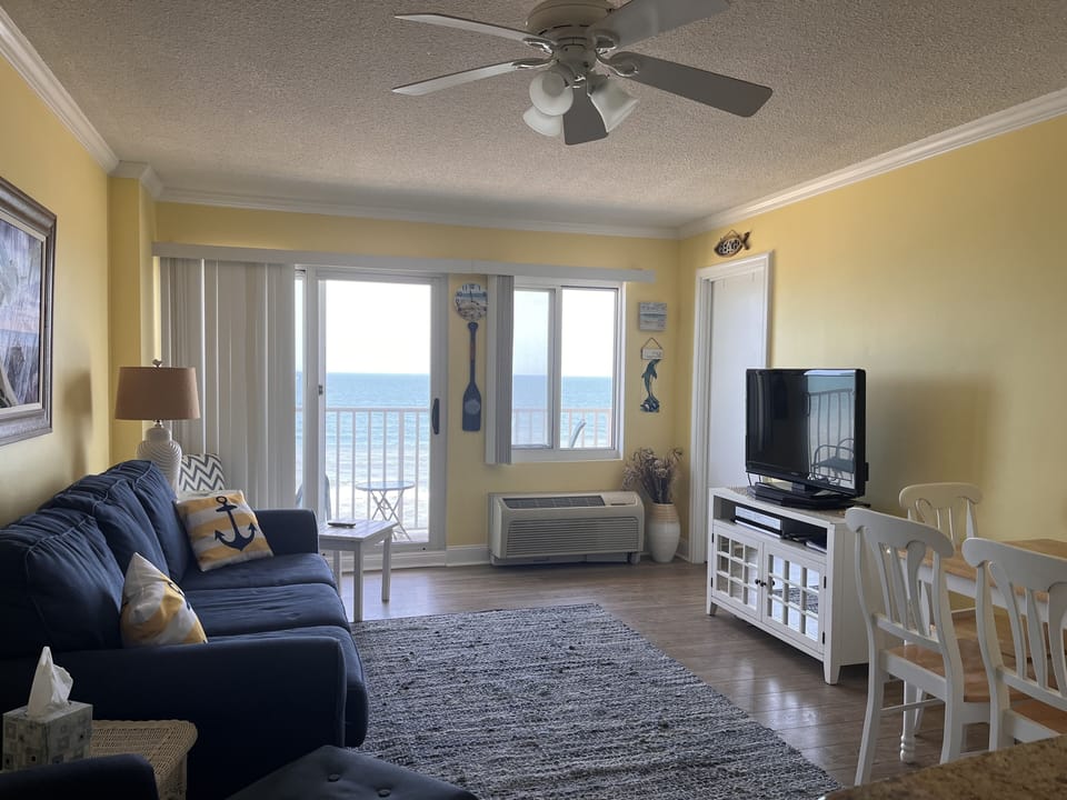 Living room and door to balcony for amazing ocean views