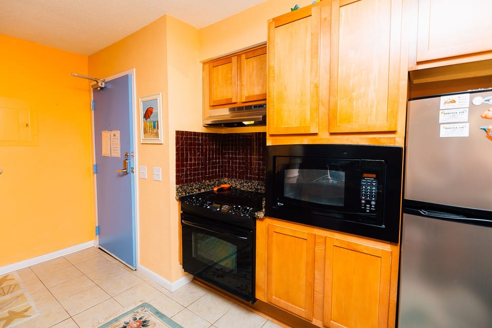 FULL KITCHEN WITH RANGE, MICROWAVE, REFRIGERATOR AND DISHWASHER