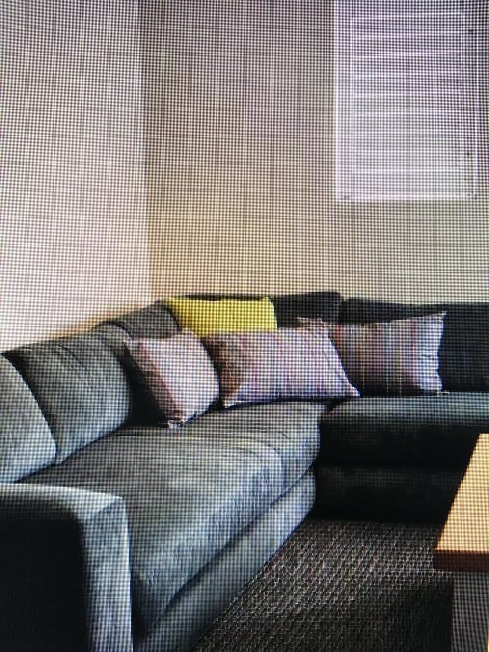 Downstairs spacious living room with inviting sofas