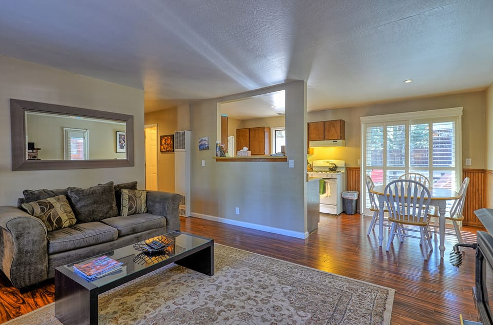 Living area & kitchen, looking out to backyard