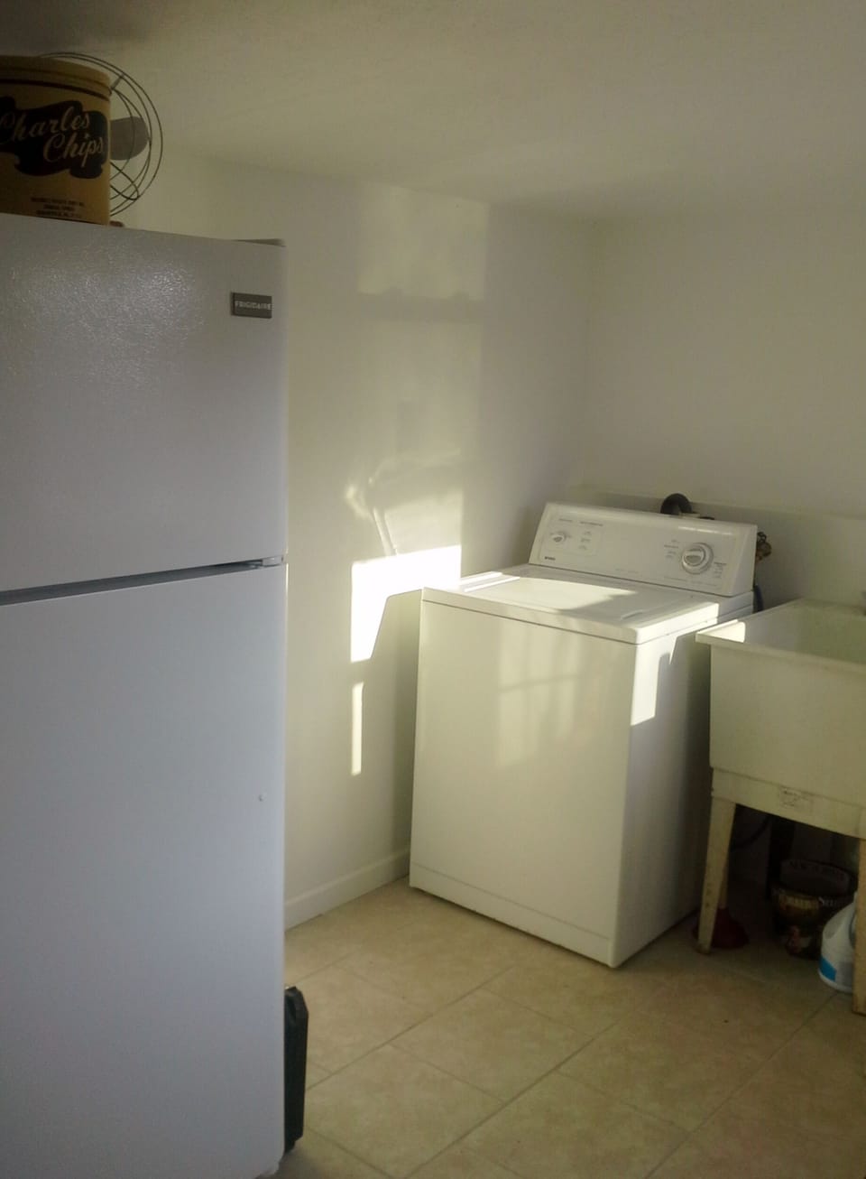 Laundry room with washer & dryer and side entrance for easy clean ups.