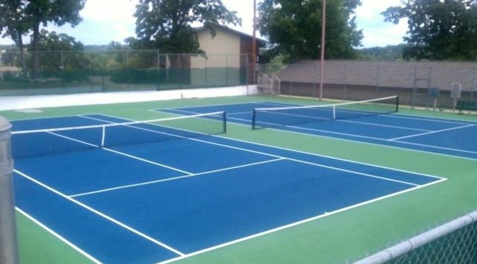 Two well maintained tennis courts which are lighted for evening play.
