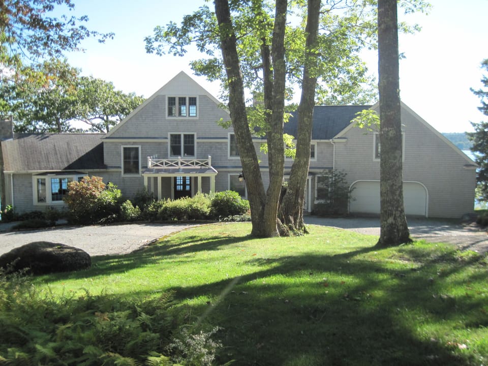 A graceful entrance to a lovely house sitting by the shore of Blue Hill Bay.