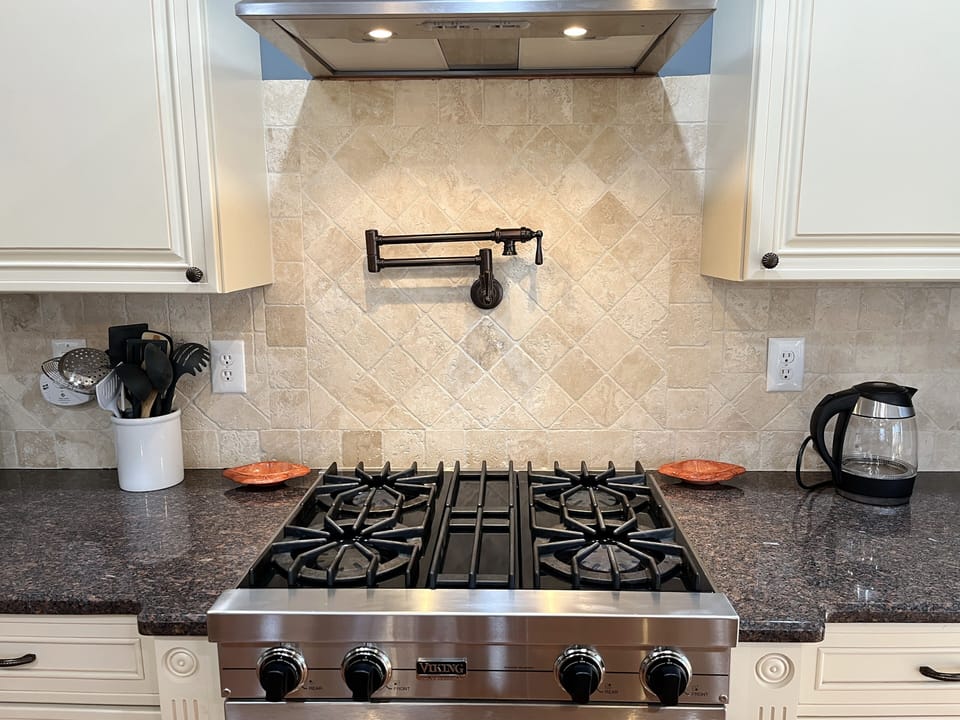 Gourmet Viking range. Convenient pot filler faucet. Electric kettle.
