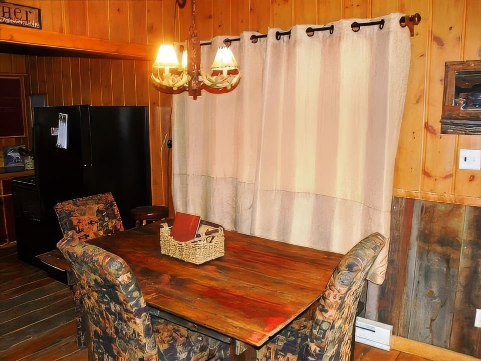Antique dining table with upholstered chairs