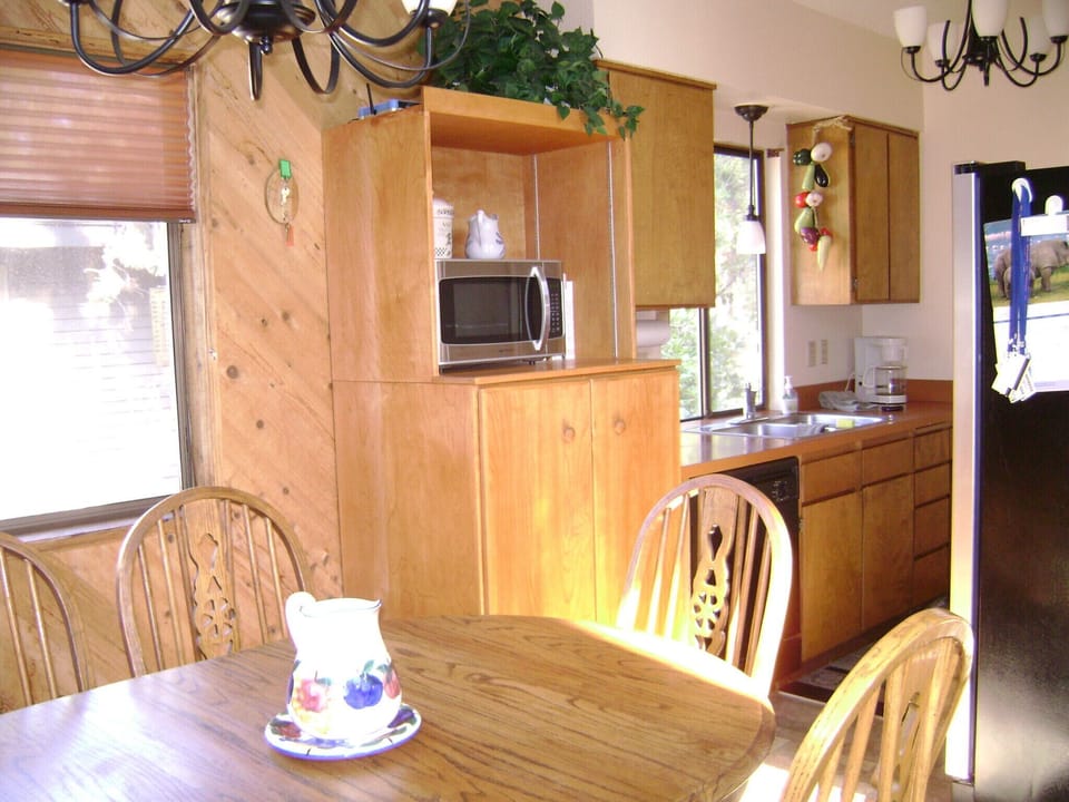 fully stocked kitchen with all dishes, pots and pans