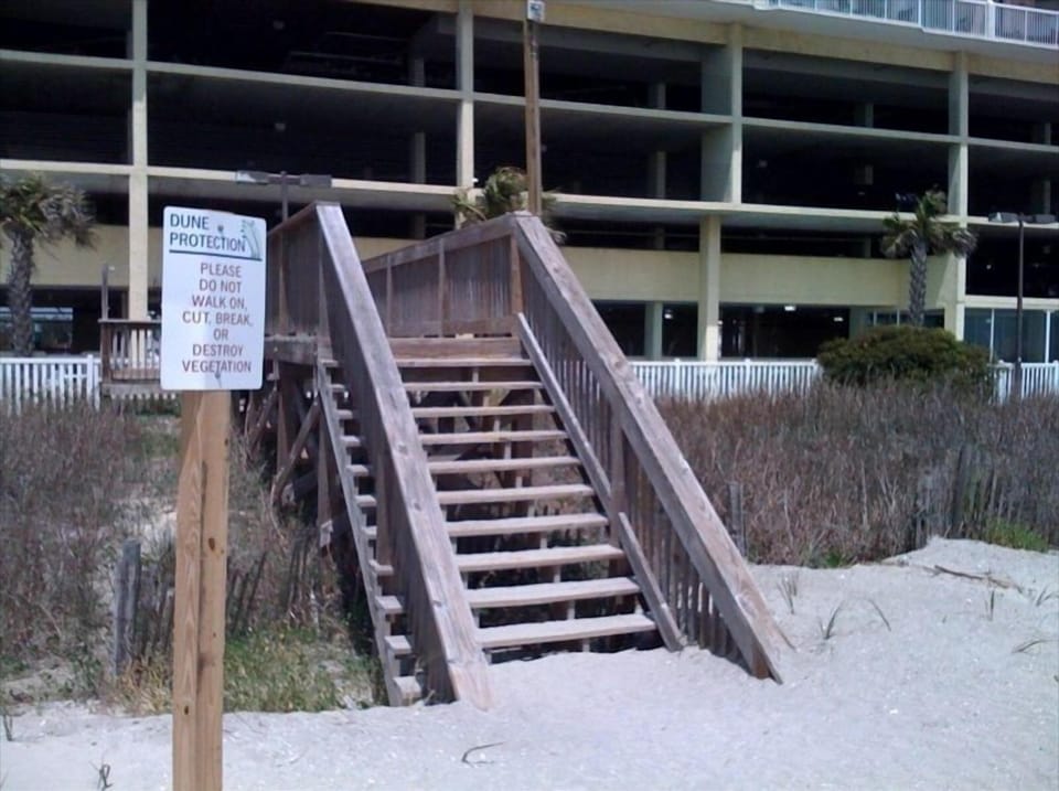 You are just steps to the beach.  Cross over the dunes and sink your toes in.