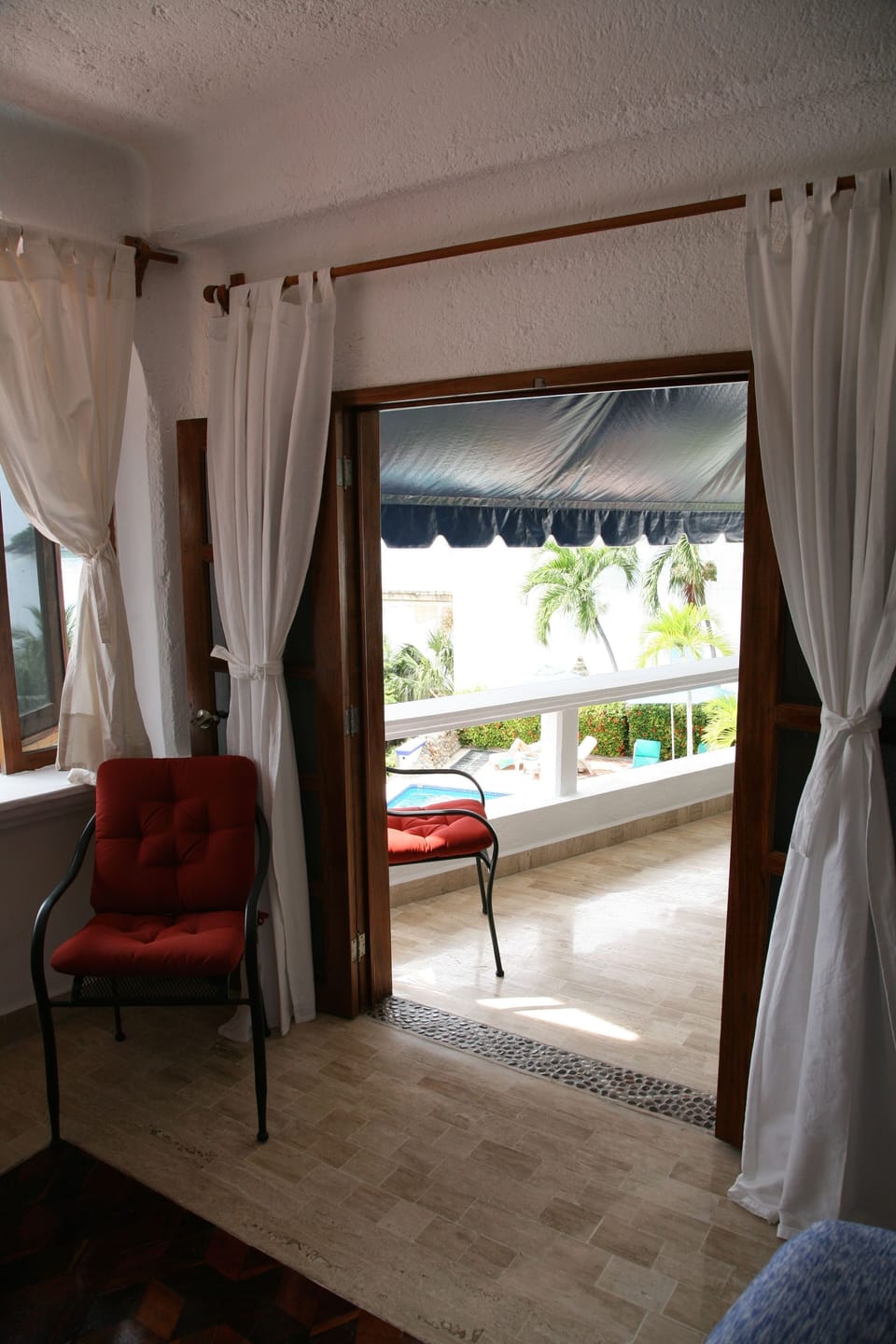 second bedroom: french doors to view and living area