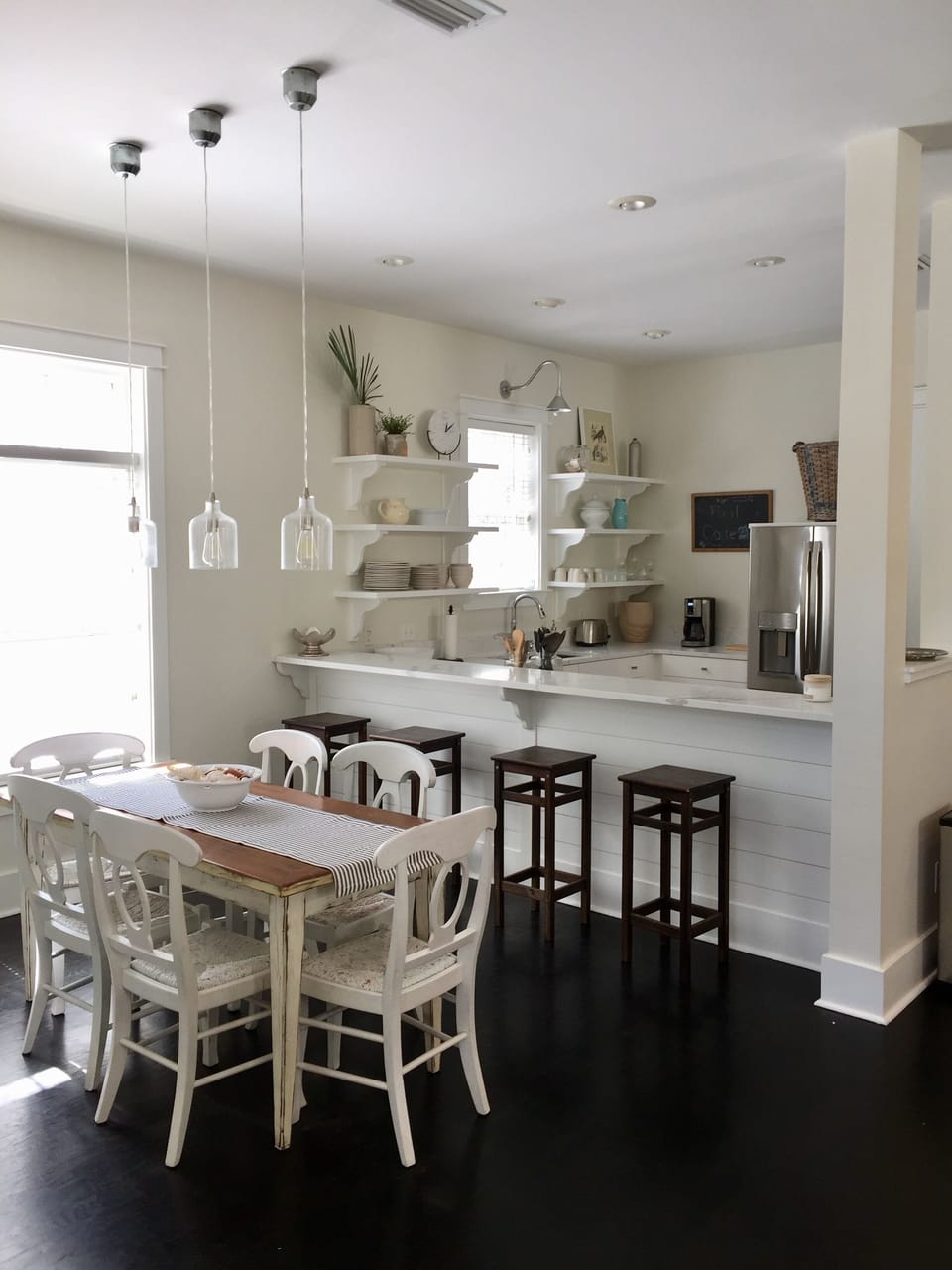 Dining area open to bar and kitchen