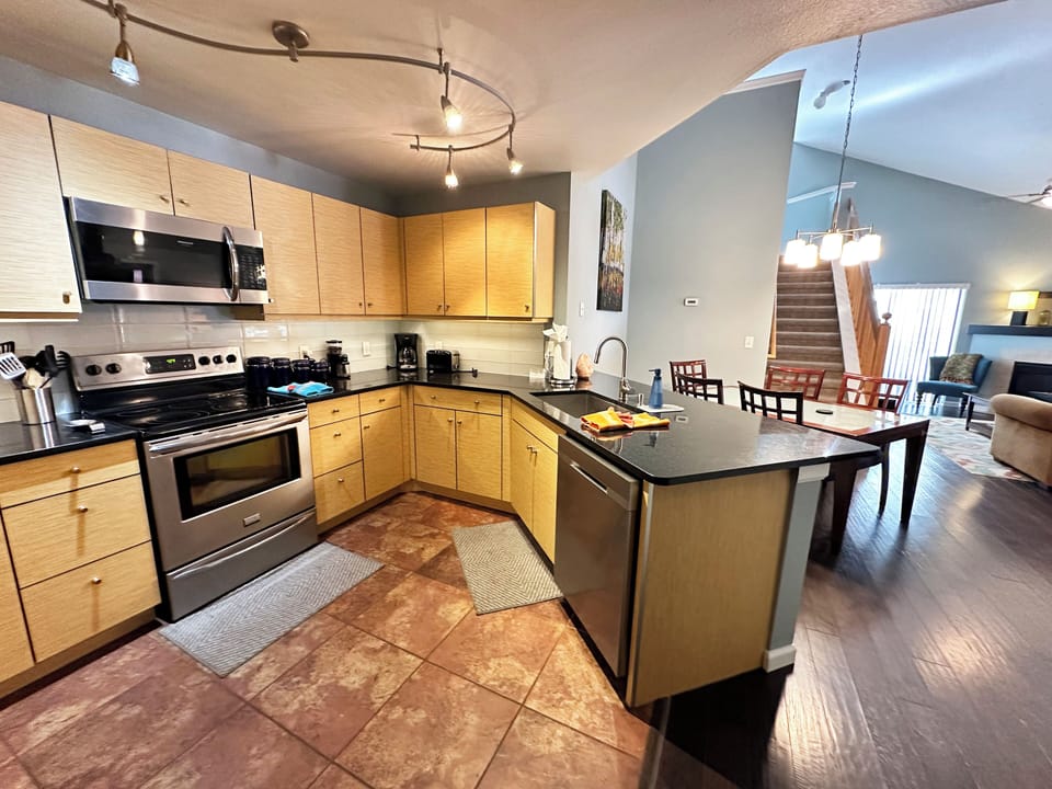 Large kitchen with plenty of counter space for meal preparation.