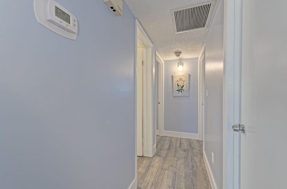 Hallway to two bedrooms two baths and laundry room