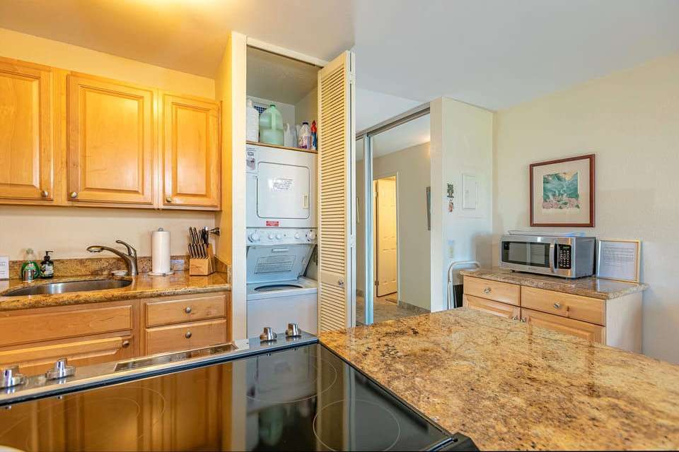 Kitchen with washer and dryer