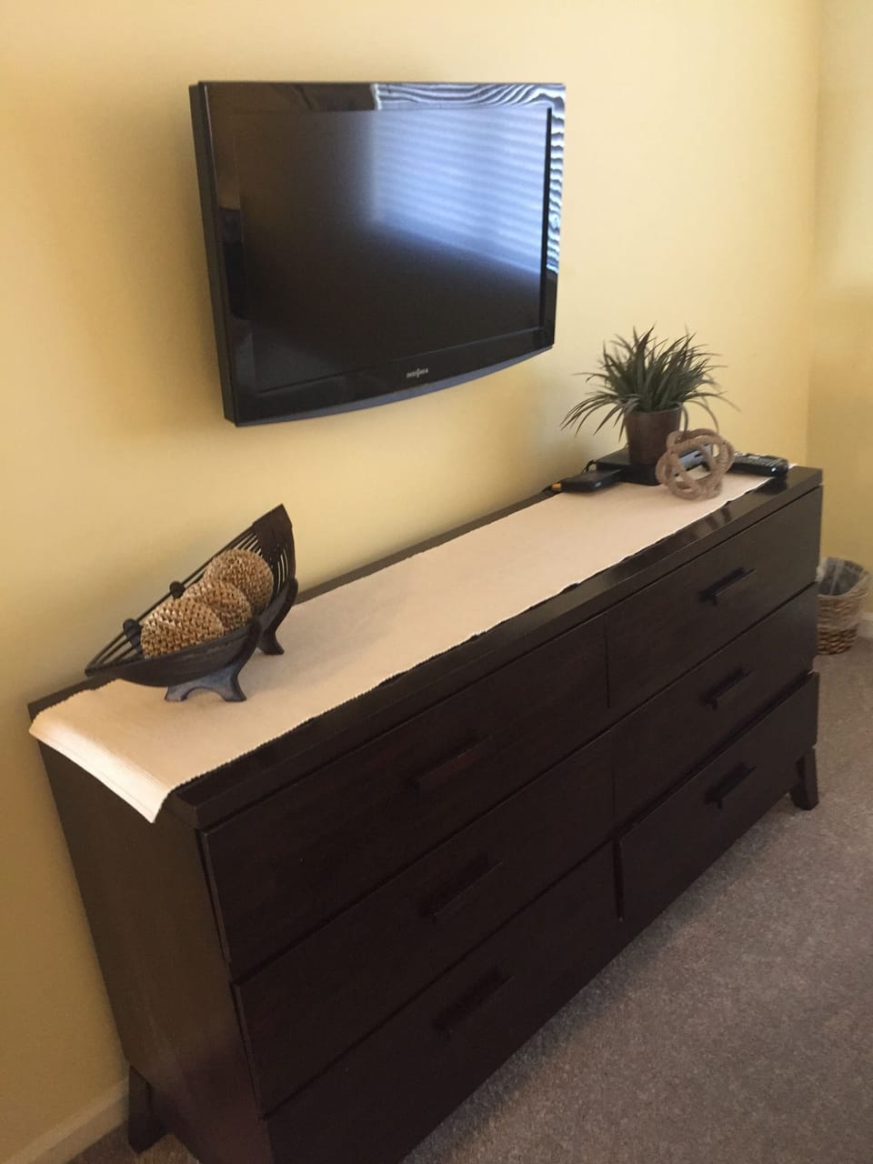 Flat screen wall mounted TV in guest bedroom