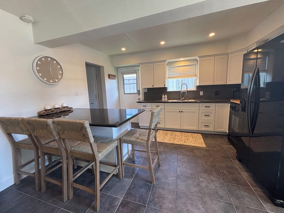 Open concept kitchen, dining and living room.