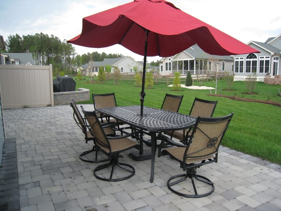 Spacious backyard/patio (not in display: 2 grills, 4 additional chairs)
