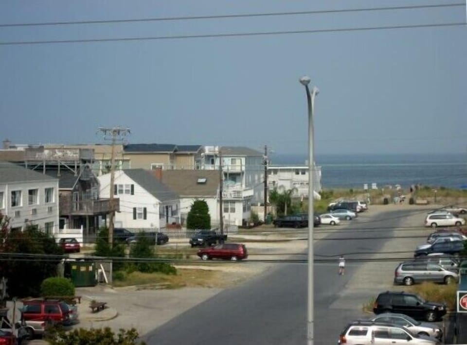 View of beach while looking out to the right of the french doors in the living
