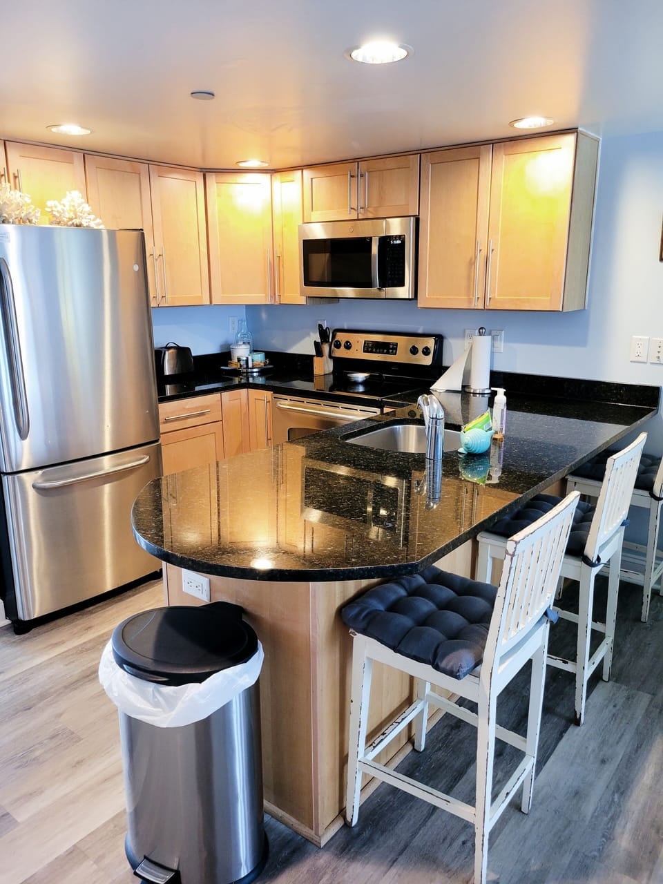 fully equipped kitchen with stainless steel appliances