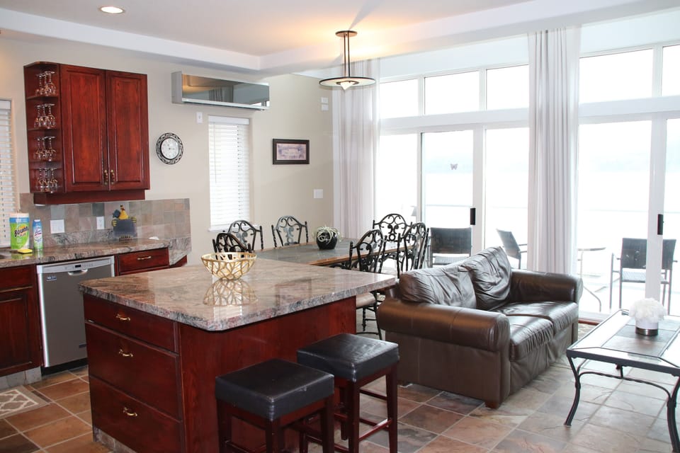 Floor to Ceiling windows to the lake with views to the lake and deck in front. 
