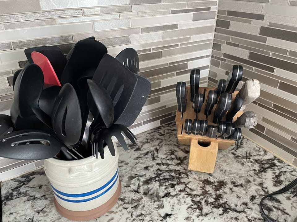 Knife set and cooking tools in unit.