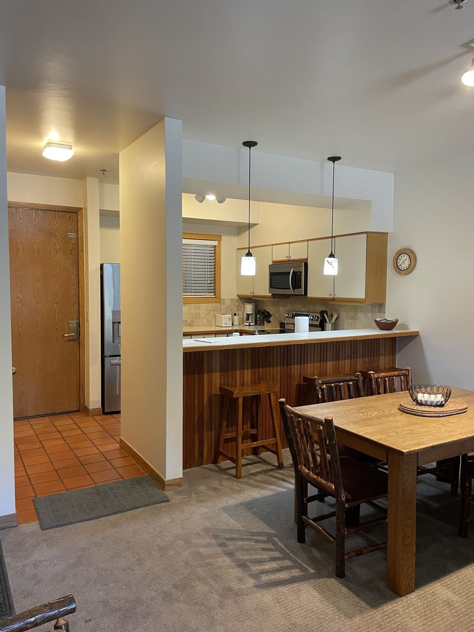Kitchen and 3 bar stools.