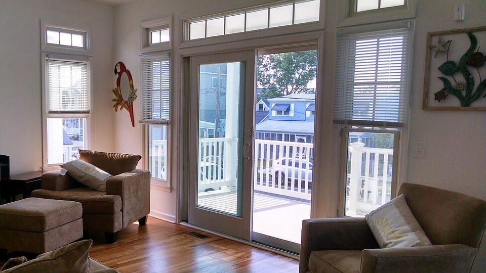 Living Room with Sliding Glass Doors To Balcony