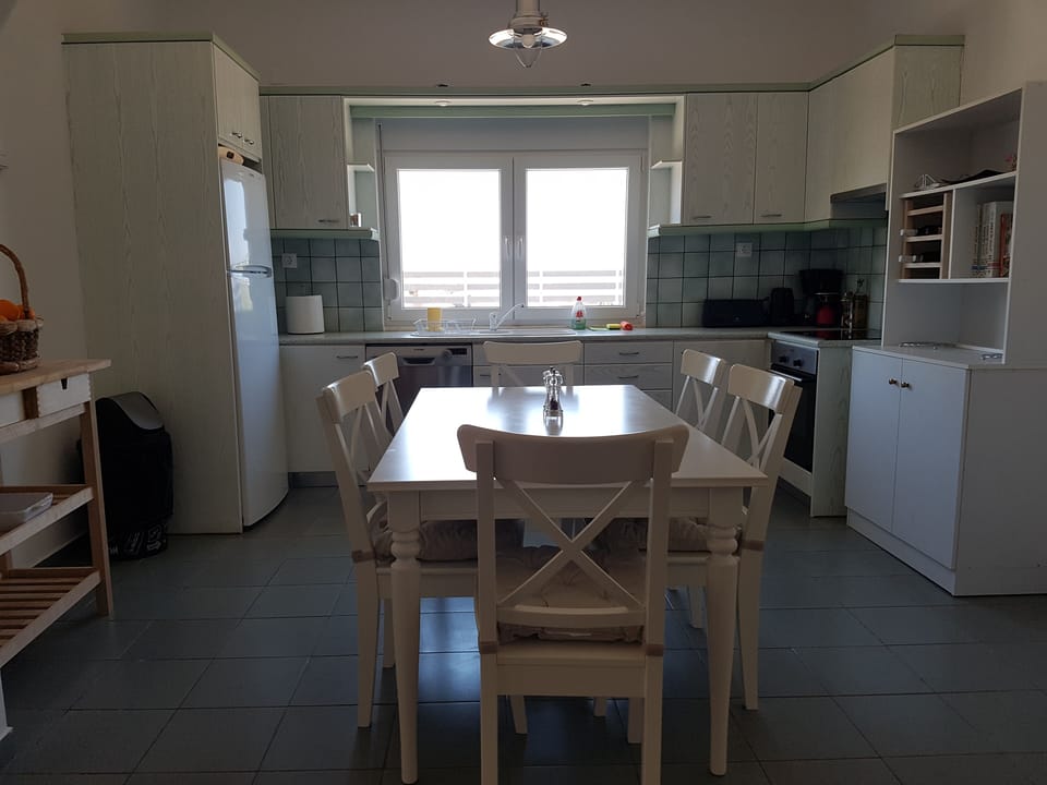 Fully equipped kitchen with seafront large windows