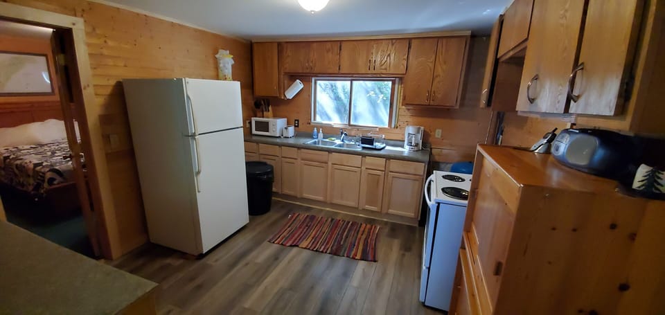 full kitchen with all cookware, untinsels, dinnerware and more.