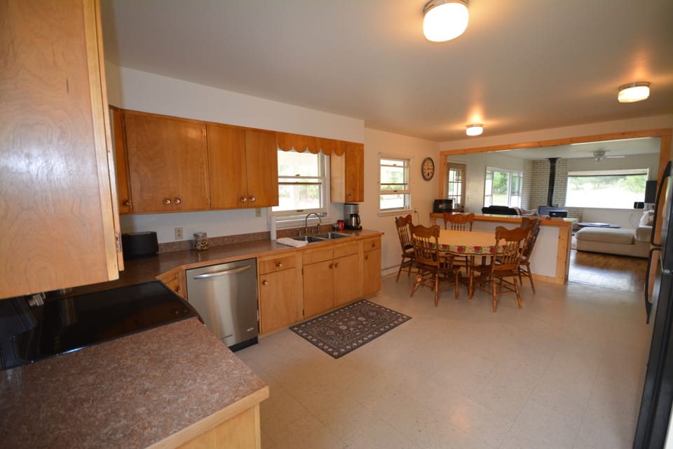 Fully stocked kitchen with dining room table. 