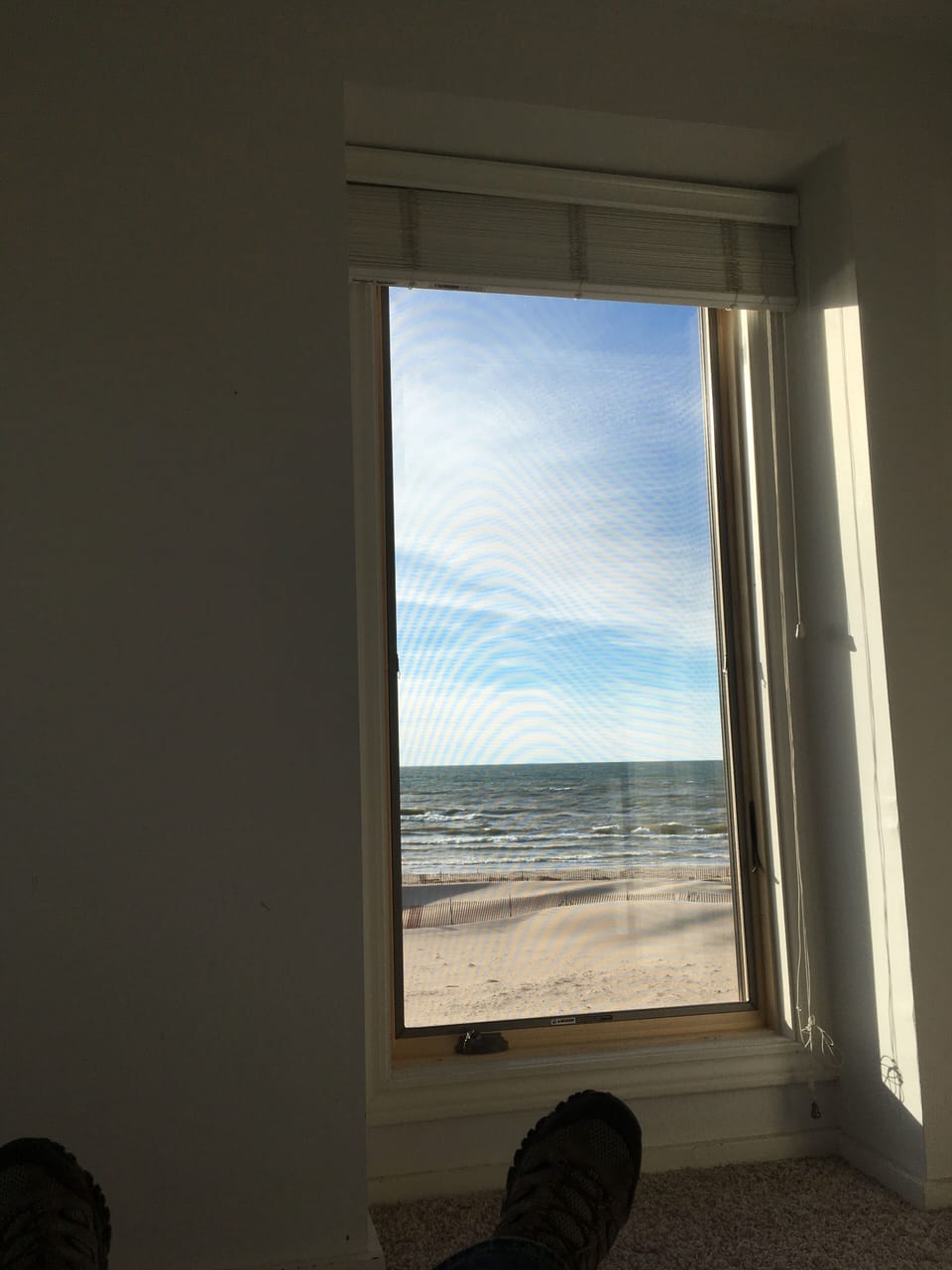 Laying in bed, looking at the lake.  All three bedrooms have lake views!