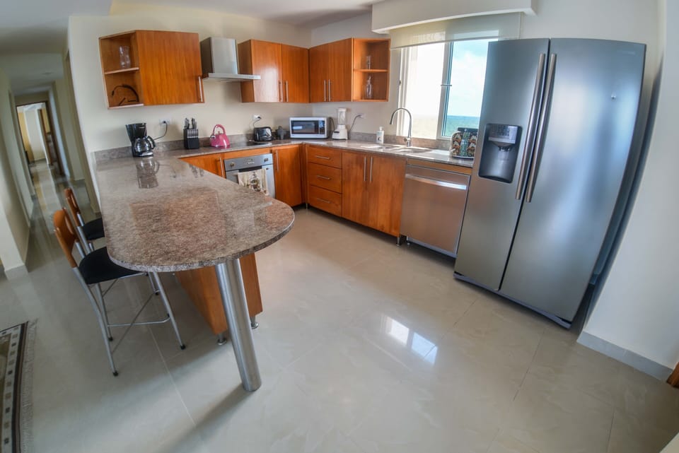 Gourmet kitchen with everything you need, including a 4 guest bar