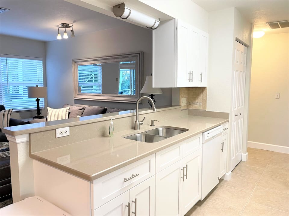 Shaker style cabinets, Quartz Countertops and Stainless Steel appliances.