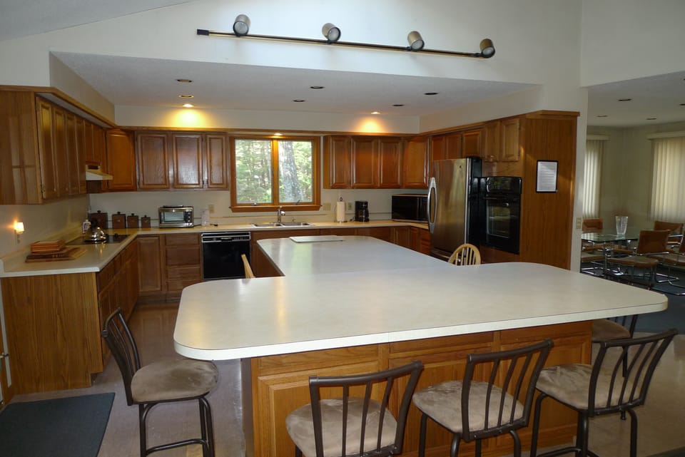 Lg. SS refrig w/ ice maker, GE. wall oven, MW, Kit Aid DW,  smooth range cooktop