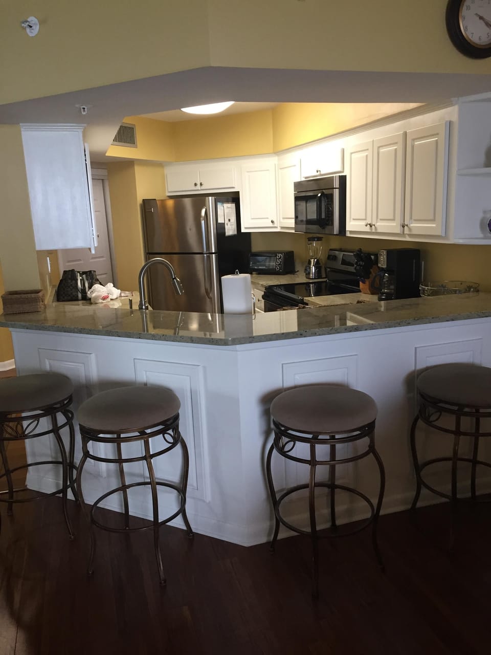 Four bar stools for extra seating in dining room
