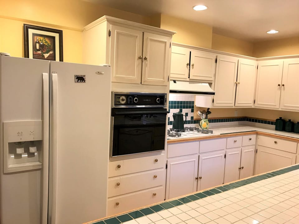 Fully stocked kitchen.  Microwave in cupboards above oven.