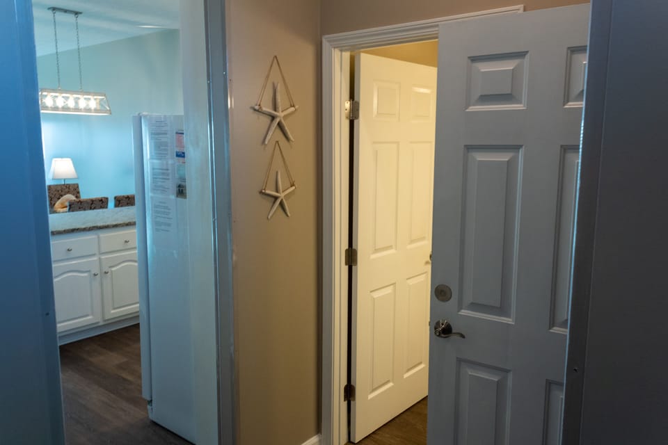 Hall bathroom steps away from garage bedroom.