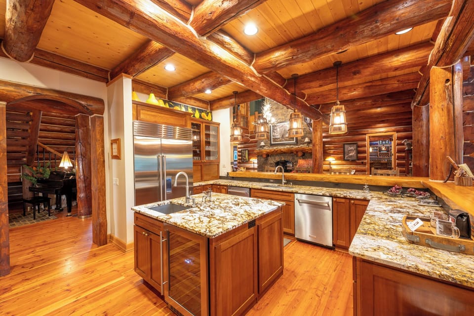 Views to the living room, piano and dining to the right from the chef's kitchen.