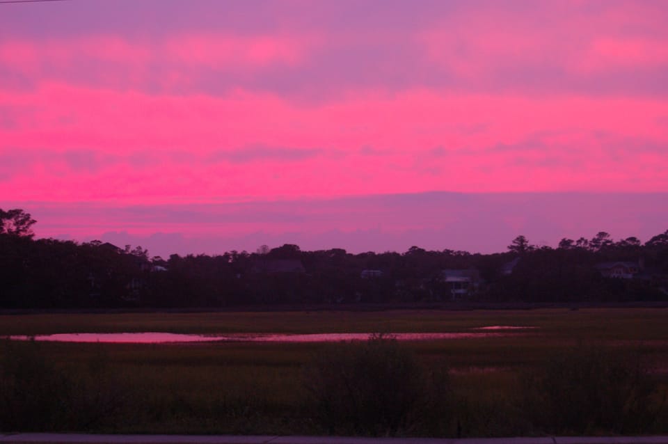 Enjoy the sunset over the marsh from the front steps of Vista Soleil. 