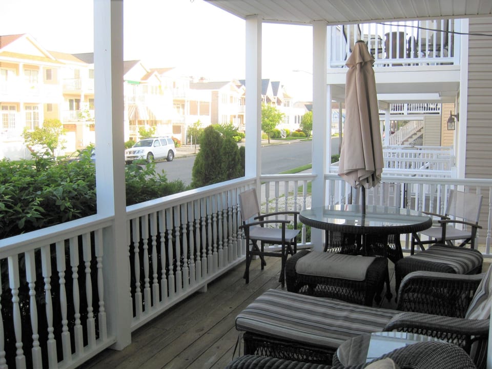 Front porch seating, table, (new dining chairs not shown)