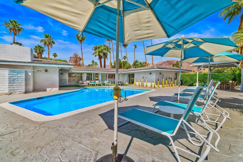 pool deck with 6 lounge chairs